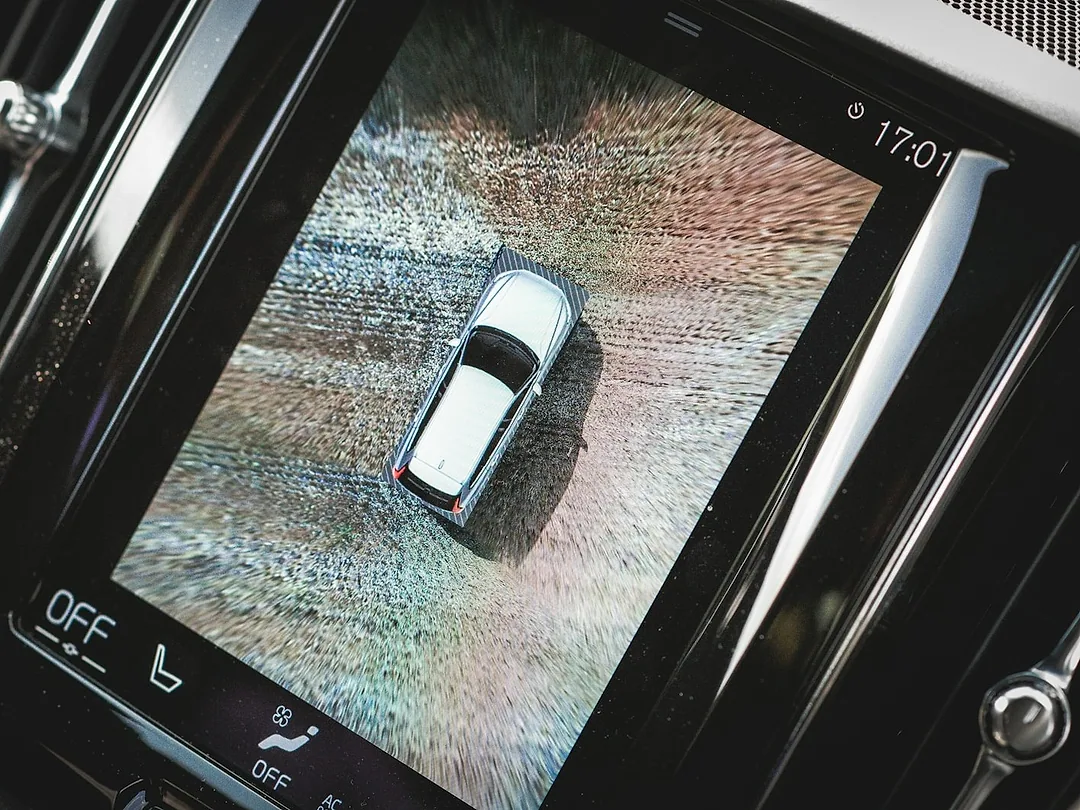 A car's screen showing the bird's-eye view from a surround camera