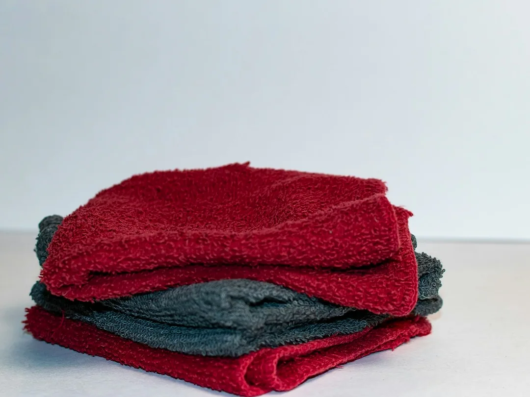 A stack of red and grey microfibre cloths