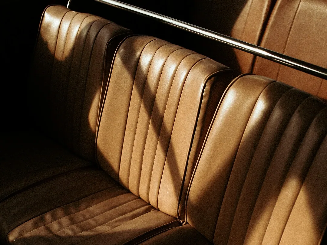 Close-up of a brown leather car seat
